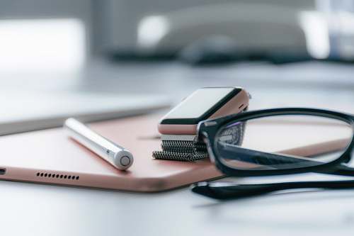 electronics eyeglasses on table mobile phone